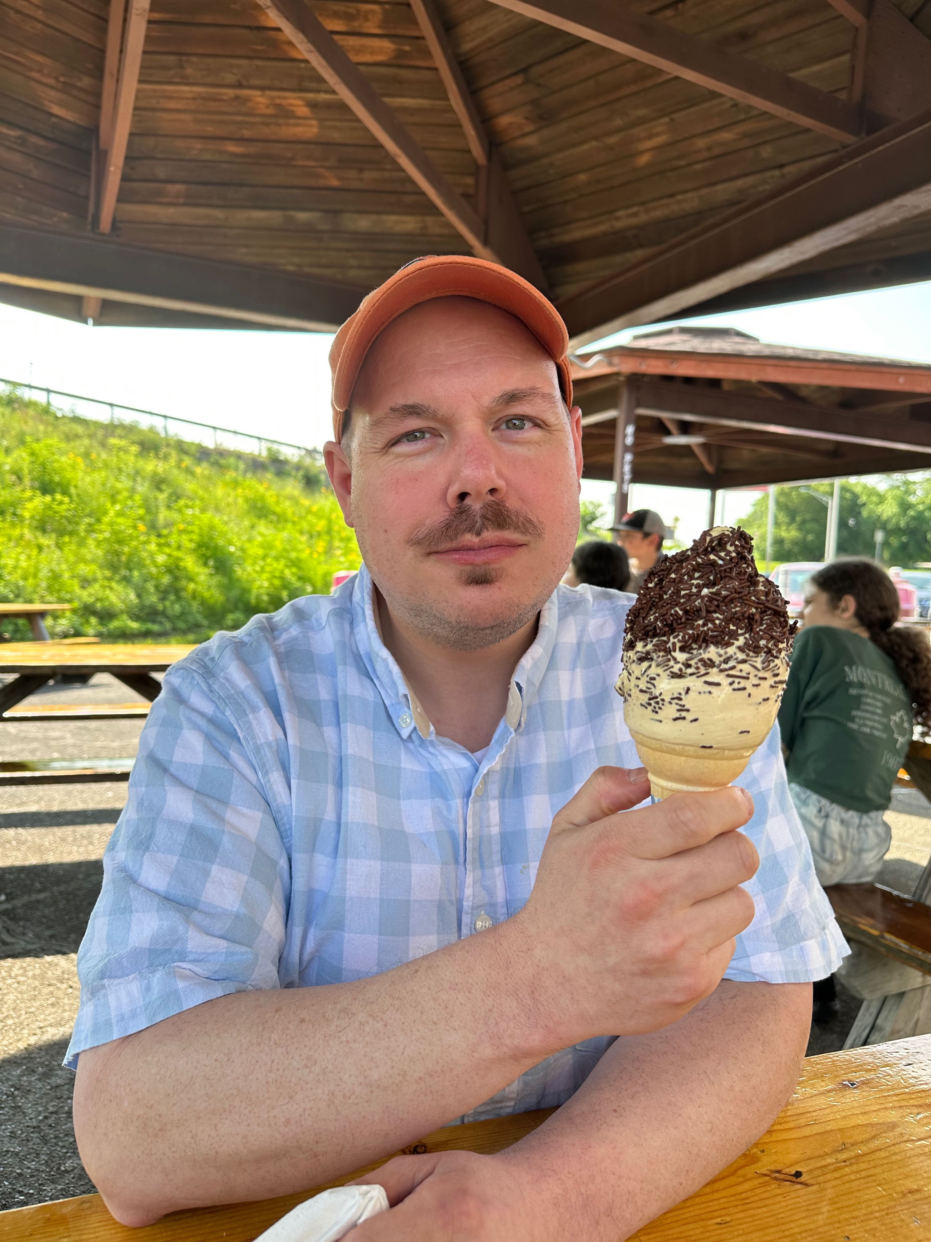 A chubby man eating icecream at the Jumpin Jacks in Scotia, NY